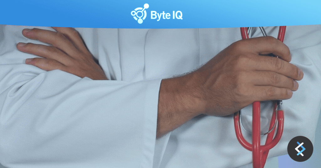 Photo of a doctors arms crossed holding a red stethoscope, Byte IQ logo above