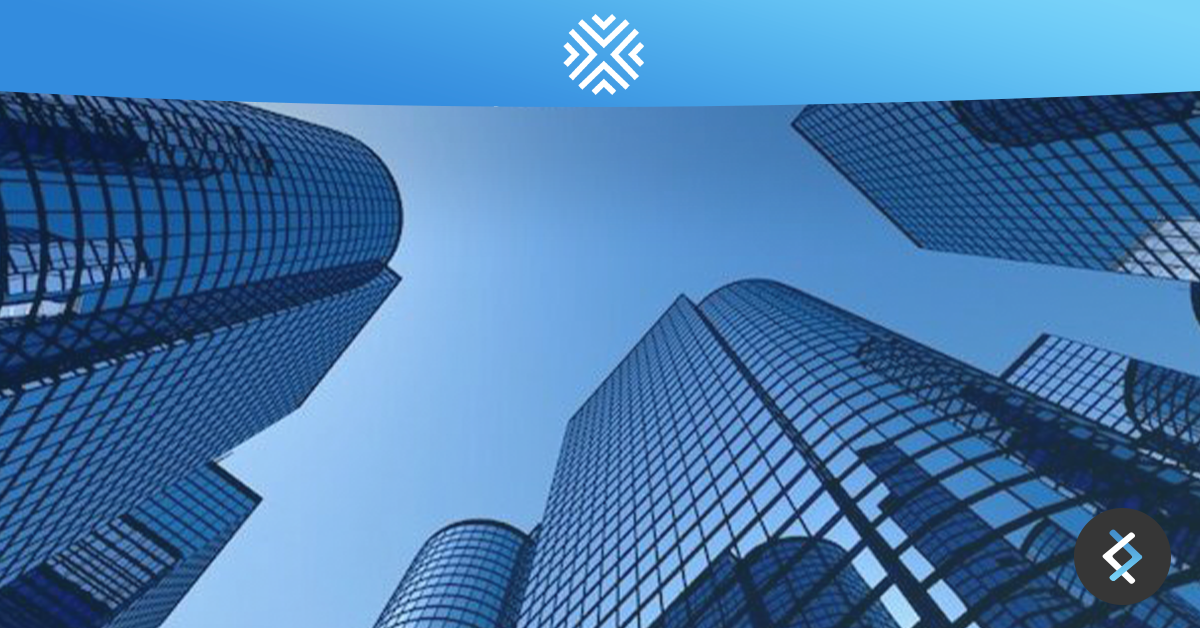 Photo looking up at tall building, with the Cribz logo at the top of the image on top of a blue banner, and the DNX logo in the bottom right corner.