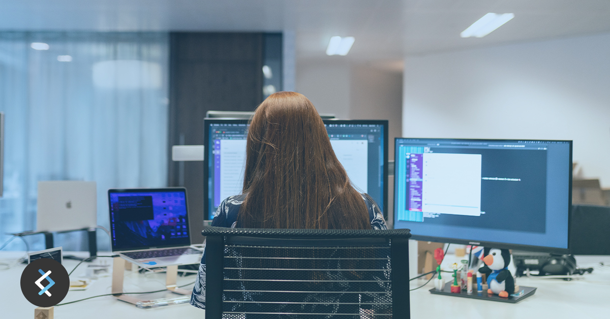 Woman sitting at a computer desk